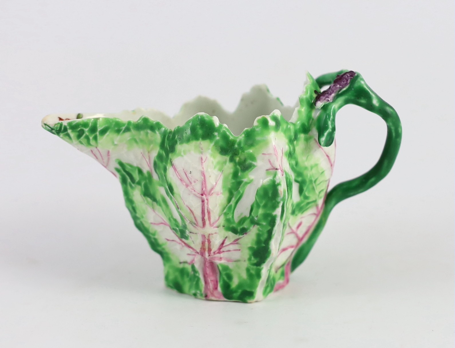 A Longton Hall cream jug, c.1755, 12.5cm long 8.1 cm high, hairline cracks